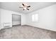 Bright bedroom with neutral carpet, modern window and spacious closet access at 138 Fairway Dr, Indianapolis, IN 46260