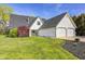 Beautiful home with a well-maintained lawn, featuring white siding and a two-car garage at 138 Fairway Dr, Indianapolis, IN 46260