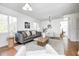 Bright living room with modern furnishings, a stylish sofa, and plenty of natural light from large windows at 138 Fairway Dr, Indianapolis, IN 46260