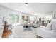 Bright living room with a sliding glass door, comfortable seating, and modern decor for a welcoming ambiance at 138 Fairway Dr, Indianapolis, IN 46260