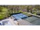 Aerial view of tennis courts and a pool at a golf club, perfect for sports and recreation enthusiasts at 138 Fairway Dr, Indianapolis, IN 46260