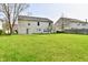 Large backyard with lush green grass and a simple patio area, perfect for outdoor enjoyment at 13858 Meadow Lake Dr, Fishers, IN 46038