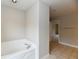 Bright bathroom showcasing a soaking tub and tiled flooring at 13858 Meadow Lake Dr, Fishers, IN 46038