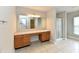 Large bathroom featuring a vanity with storage and a shower with a glass door at 13858 Meadow Lake Dr, Fishers, IN 46038