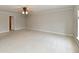 Bright bedroom featuring neutral carpeting, crown molding, and ample space at 13858 Meadow Lake Dr, Fishers, IN 46038