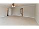 Neutral carpeted bedroom features doorways and ample floor space at 13858 Meadow Lake Dr, Fishers, IN 46038