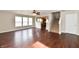 Open-concept living area with wood floors, large windows, and easy access to the kitchen and stairs at 13858 Meadow Lake Dr, Fishers, IN 46038