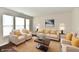 Staged living room featuring neutral furniture, a sisal rug, and bright natural light at 13858 Meadow Lake Dr, Fishers, IN 46038