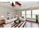 Cozy living room with bright furniture, stylish rug, and large windows at 13858 Meadow Lake Dr, Fishers, IN 46038