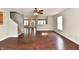 Spacious living room with dark wood floors, a staircase, and plenty of natural light at 13858 Meadow Lake Dr, Fishers, IN 46038