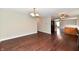 Open concept living room featuring hardwood floors adjacent to the kitchen at 13858 Meadow Lake Dr, Fishers, IN 46038