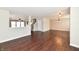 Bright living room with hardwood floors, modern lighting, and open floor plan at 13858 Meadow Lake Dr, Fishers, IN 46038