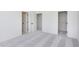 Spacious bedroom with plush carpet and multiple doorways for easy access at 14551 Hanford Ln, Carmel, IN 46074