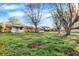 Large backyard showcasing mature trees, providing ample space and a sense of privacy for outdoor enjoyment at 1457 Biloxi Ln, Beech Grove, IN 46107
