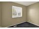 Bright bedroom with window, carpet flooring, and natural light is perfect for rest and relaxation at 1457 Biloxi Ln, Beech Grove, IN 46107
