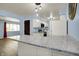 Tastefully updated kitchen with modern lighting, sleek countertops, and ample cabinet space at 1457 Biloxi Ln, Beech Grove, IN 46107