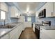 Well-lit kitchen with modern appliances, stylish counters, and ample space for cooking and entertaining at 1457 Biloxi Ln, Beech Grove, IN 46107