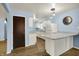 Bright kitchen with white cabinets, granite countertops, and modern appliances for a fresh look at 1457 Biloxi Ln, Beech Grove, IN 46107
