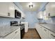Bright laundry area featuring modern appliances and ample countertop space for convenience at 1457 Biloxi Ln, Beech Grove, IN 46107