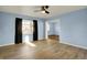Open living area featuring newer flooring, neutral paint, and tons of natural light at 1457 Biloxi Ln, Beech Grove, IN 46107