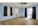 Large living room with a ceiling fan and natural light is perfect for relaxation and entertainment at 1457 Biloxi Ln, Beech Grove, IN 46107