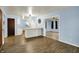Spacious open-concept living area that flows to a bright kitchen with modern appliances at 1457 Biloxi Ln, Beech Grove, IN 46107