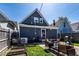 Backyard featuring a patio set for outdoor dining and mature landscaping at 1626 S Delaware St, Indianapolis, IN 46225