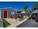 Backyard featuring a stone patio with outdoor seating and a detached garage at 1626 S Delaware St, Indianapolis, IN 46225