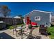 Outdoor patio with seating, a fire pit, and a detached garage at 1626 S Delaware St, Indianapolis, IN 46225