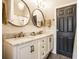 Bathroom featuring a double sink vanity with a marble countertop at 1626 S Delaware St, Indianapolis, IN 46225