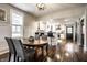 Open-concept dining room leading to a modern, white kitchen at 1626 S Delaware St, Indianapolis, IN 46225