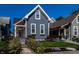 Charming home with a welcoming front porch and well-manicured landscaping at 1626 S Delaware St, Indianapolis, IN 46225