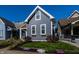 Charming home with a manicured lawn, beautiful flowers, and inviting curb appeal at 1626 S Delaware St, Indianapolis, IN 46225