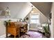 Charming attic office with roll top desk, plenty of natural light, and stylish decor at 1626 S Delaware St, Indianapolis, IN 46225