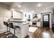 Bright, modern kitchen featuring white cabinetry, granite countertops, and stainless steel appliances at 1626 S Delaware St, Indianapolis, IN 46225