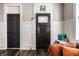 Stylish living room with paneled walls, modern lighting, and comfortable seating at 1626 S Delaware St, Indianapolis, IN 46225