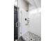 Modern shower with white subway tile, glass door, and mosaic tile flooring at 1626 S Delaware St, Indianapolis, IN 46225