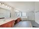 Bright bathroom featuring double vanity, soaking tub, and walk-in shower at 16994 Folly Brook Rd, Noblesville, IN 46060