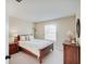 Bedroom with cozy décor featuring wood furnishings and natural light at 16994 Folly Brook Rd, Noblesville, IN 46060