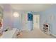 Well-organized bedroom featuring an open doorway, calming wall colors, and carpet flooring at 16994 Folly Brook Rd, Noblesville, IN 46060