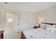 Bedroom featuring natural light, wood furnishings and a closet at 16994 Folly Brook Rd, Noblesville, IN 46060
