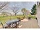 Outdoor deck with patio furniture and a view of the large, well-maintained backyard at 16994 Folly Brook Rd, Noblesville, IN 46060