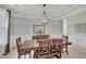 Elegant dining room featuring a stylish chandelier and wainscoting at 16994 Folly Brook Rd, Noblesville, IN 46060