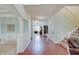 Bright foyer features hardwood flooring, white columns, and staircase at 16994 Folly Brook Rd, Noblesville, IN 46060