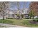 Charming two-story home featuring a combination of brick and siding, complemented by a well-manicured lawn and mature trees at 16994 Folly Brook Rd, Noblesville, IN 46060