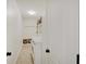 Well-lit laundry room with washer, dryer, shelving, and seating area at 16994 Folly Brook Rd, Noblesville, IN 46060