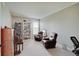Bright living room featuring two leather chairs and a bookshelf near a window at 16994 Folly Brook Rd, Noblesville, IN 46060