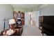 Open concept living room featuring a leather chair, desk and piano at 16994 Folly Brook Rd, Noblesville, IN 46060