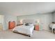 Main bedroom with a large comfortable bed, side tables and a desk at 16994 Folly Brook Rd, Noblesville, IN 46060