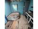 Bathroom with blue walls, stand up shower, and vanity at 1704 E Kirk St, Muncie, IN 47303